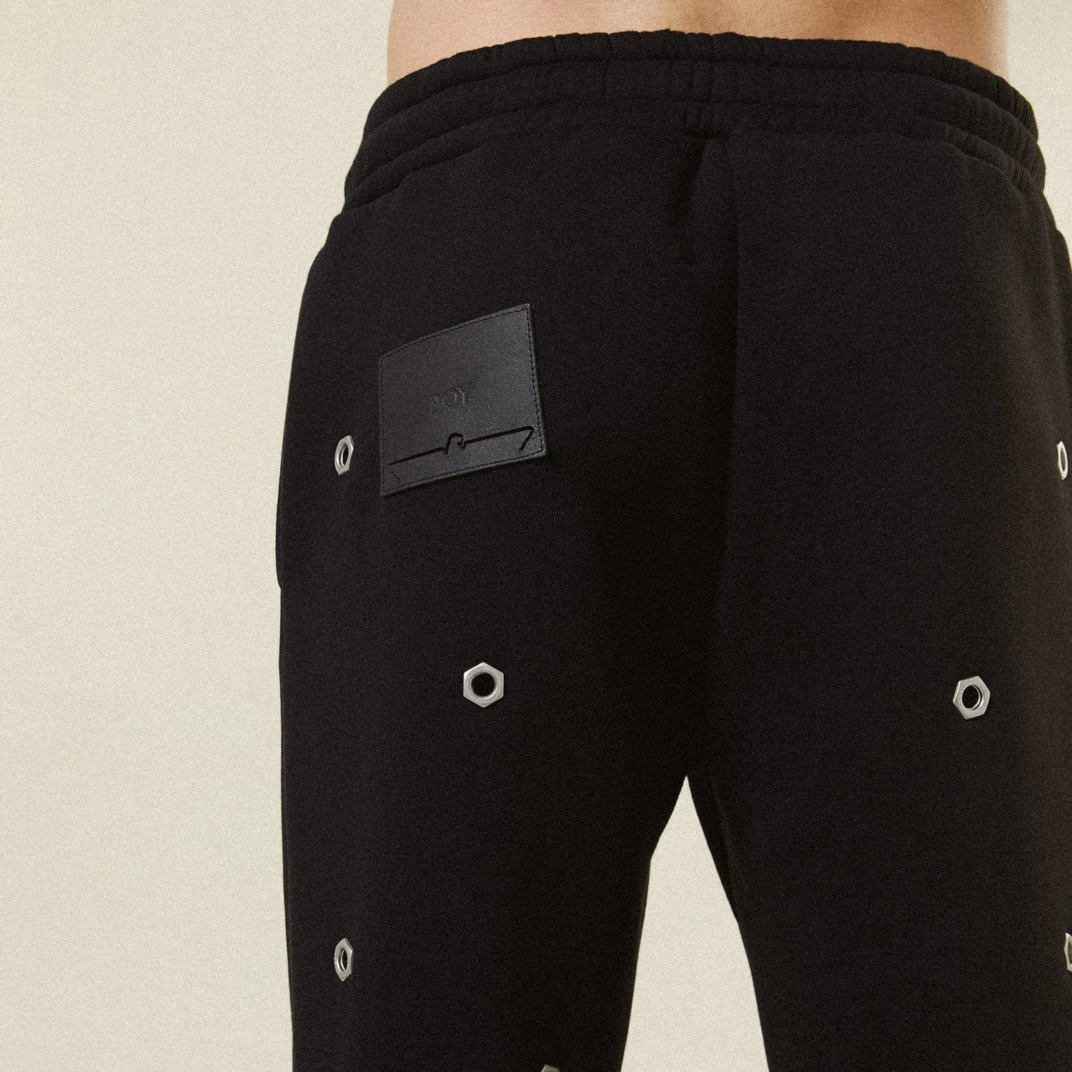 MULTI EYELET TRACK PANTS - BLACK